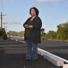 South Seas Gallery and Coffee Shop owner Janet Weir-Crooks with the controversial concrete kerb...