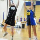 Southern goal defence Lorie McDonald intercepts a pass intended for Phys Ed A's Clair Adams...