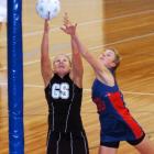 Southern goal shoot Mel Winter competes for the ball 
...