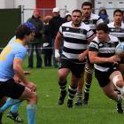 Southern Hooker Ricky Riccitelli drives the ball up for Southern in the early stages in the clash...