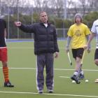 Southern Men's coach Dave Ross gives instructions during a training session at the McMillan...