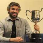 Southern No 8 Andrew Stead holds the trophy for the Dunedin club rugby player of the year at an...