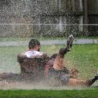 Southern's Hanipale Galo and Damian Keane contest for a loose ball on the Harbour tryline in...