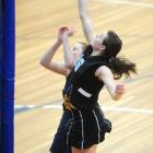 Southern's Kate Shearer shoots past Phys Ed's Hannah Coutts in their Dunedin premier netball game...