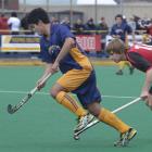 Southern's Tom Clarkson evades Canterbury's Ryan Cocking during a national under-21 tournament...