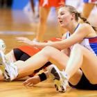 Southern Steel defender Katrina Grant (right) falls to the ground after clashing with Tactix wing...