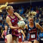 Southern Steel wing attack Shannon Francois looks for support past Tactix wing defence Hayley...