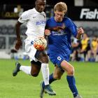 Southern United’s Andrew Ridden is unable to stop Auckland City’s Joao Moreira from continuing on...