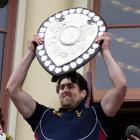 Southland Stags captain Jamie Mackintosh holding the Ranfurly Shield. Photo by NZPA.