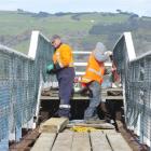 SouthRoads Ltd construction worker Davey Grant (left) and leading hand James Cook stand on...