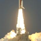 Space shuttle Discovery lifts off from the Kennedy Space Centre in Cape Canaveral, Florida on its...