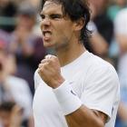 Spain's Rafael Nadal celebrates defeating Luxembourg's Gilles Muller in their match at Wimbledon...