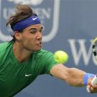 Spain's Rafael Nadal hits a forehand against US player Mardy Fish in a quarterfinal match at the...