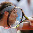 Spain's Rafael Nadal hits a return to Stanislas Wawrinka of Switzerland during their men's...