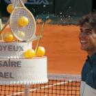Spain's Rafael Nadal looks at his birthday cake after winning his men's singles match against Kei...