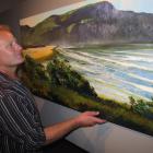 Speargrass Flat artist Graham Brinsley admires his new seascape of Purakaunui Bay, in the Catlins...