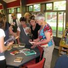 Speed dating with books: parents have 1 minute at each table to make a book selection, before...