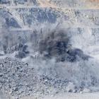 Spoil explodes skyward from Oceana Gold's main Frasers pit at its East Otago mine. Photo by Craig...