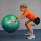Squat to ball raise: Squat down so the ball touches the ground then stand back up on to your toes...