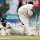 Sri Lanka's Angelo Mathews dives to complete a run as Australia's Nathan Lyon breaks the wickets...