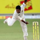 Sri Lanka's Dammika Prasad bowls during the first day of the second test against Pakistan in...