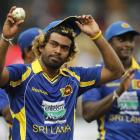 Sri Lankan bowler Lasith Malinga acknowledges the crowd after completing a hat-trick during the...