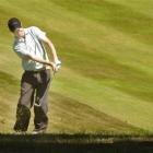 St Clair golfer Brent McEwan plays a chip shot on his way to winning the Dunedin men's...