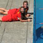 St Clair Surf Life Savers Brooke Cox (21), front, and Ana Keelty (20)  watch a 2-year-old male...