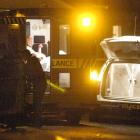 St John ambulance staff and police tend to a woman stabbed outside a Magdala St, Tainui property...