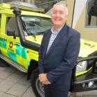 St John chief executive Peter Bradley, of Auckland, with the Glenorchy St John's customised $100...