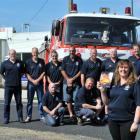 St John  paramedic Debby Foster with members of the Brighton Volunteer Fire Brigade during 50th...