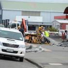 St John staff treat a patient at the scene of an explosion outside Southern Brakes and Driveline,...