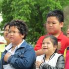 St Joseph's School pupils sing the Philippines national anthem while the country's flag is raised...