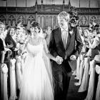 Stacey and Richard Goodson, surrounded by their guests, leave the church after their wedding...