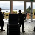 Stacking chairs inside the dining room at Otakou marae yesterday in preparation for the hundreds...