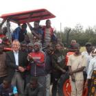 Staff and pupils at an agricultural training farm in Kenya with a new tractor, bought with New...