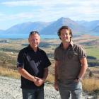 Standing at the 4km mark of the Remarkables skifield access road are ski area manager Ross...