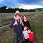 Standing on their empty Karitane section about a year after winning an Environment Court case to...