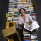 Star Regent 24 Hour Book Sale organiser Alison Cunningham leafs through one of the thousands of...