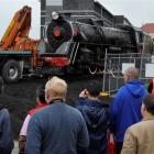Steam train enthusiasts watch the progress of the locomotive. Photo by Gerard O'Brien.