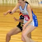 Steel goal keep Katrina Grant keeps Magic wing attack Frances Solia (obscured) at bay as they...