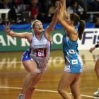 Steel goal keep Megan Hutton (left) tries to block a shot from Thunderbirds goal shoot Kate...