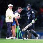 Steve Dunne congratulates New Zealand batsman Nathan Astle after his century against England at...