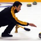 Steve Johns trains for the Australian curling championships that began at the Dunedin Ice Stadium...