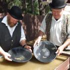 Stu Edgecumbe and his friend Bill James demonstrate their gold-panning technique.  Photo by Diane...