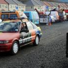 Students drive out of a parking area for Undie 500 cars behind apartments in Anzac Ave, Dunedin,...