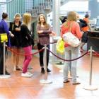 Students line up for identification cards at the University of Otago's  summer school. Photo by...