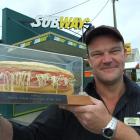 Subway Balclutha co-owner Richard Jackson admires the sandwich trophy that confirms the South...