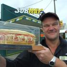 Subway Balclutha co-owner Richard Jackson admires the sandwich trophy that confirms the South...