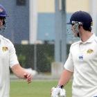 Successful Otago batsmen Sam Wells (left) and Neil Broom walk off the field in their side Plunket...